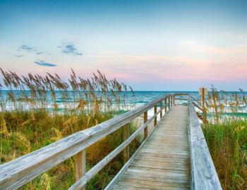 beach boardwalk at sunset