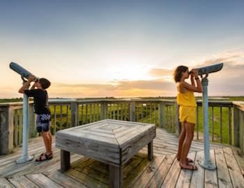 kids looking through view finders at a nature preserve in the outer banks