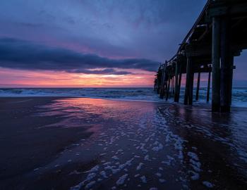 Fishing pier in outer banks at sunset