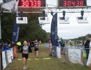 The joy of crossing the half marathon finish line at the Outer Banks Half Marathon. The joy of crossing the half marathon finish line at the Outer Banks Half Marathon.
