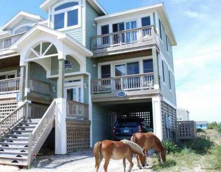 horses out front of a home on the outer banks 4x4 beaches