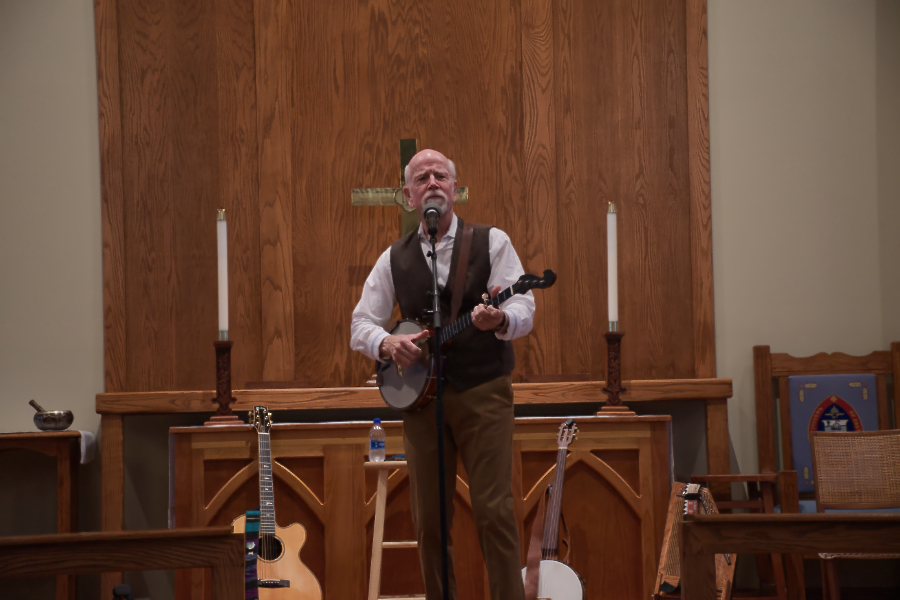 John McCutcheon performed with banjo and assorted other instruments. John McCutcheon performed with banjo and assorted other instruments.